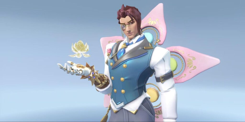 A character from Overwatch in a blue and white outfit with a pink winged motif holds a glowing lotus flower, set against a soft blue background.