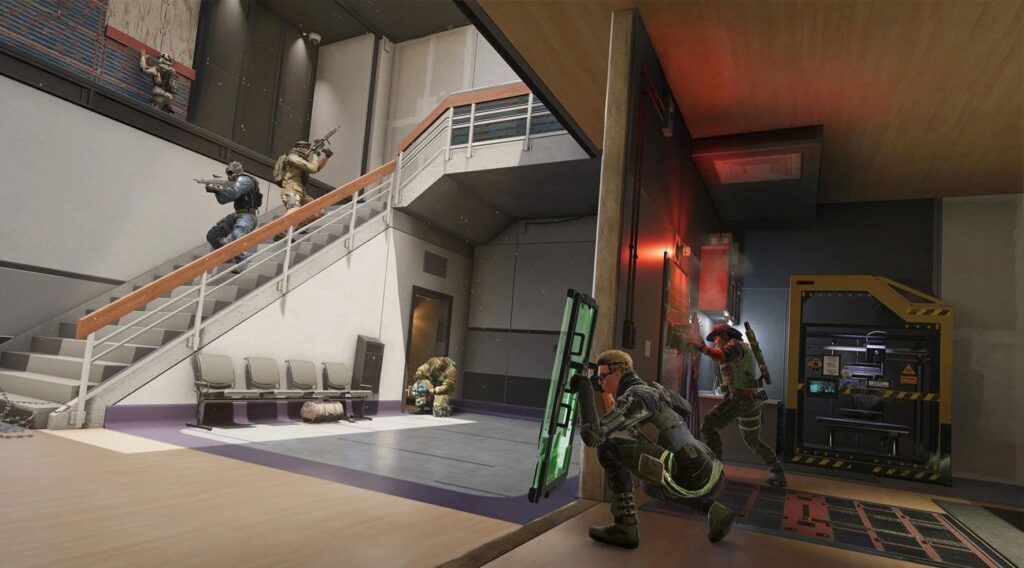 Operators set up a site defense in Siege X as attackers move in upstairs
