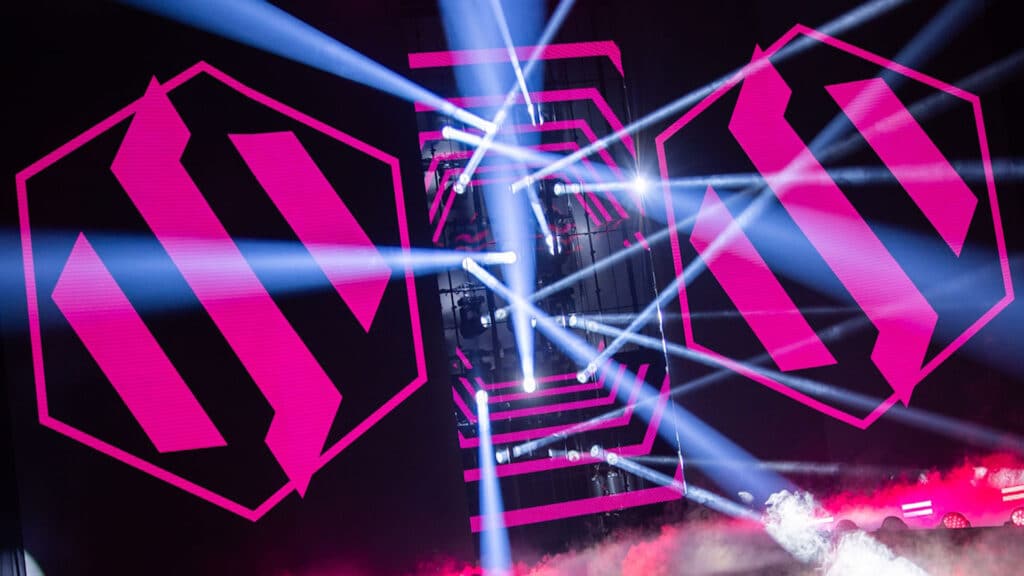 Image of Team BDS logo projected on to a screen illuminated by lights