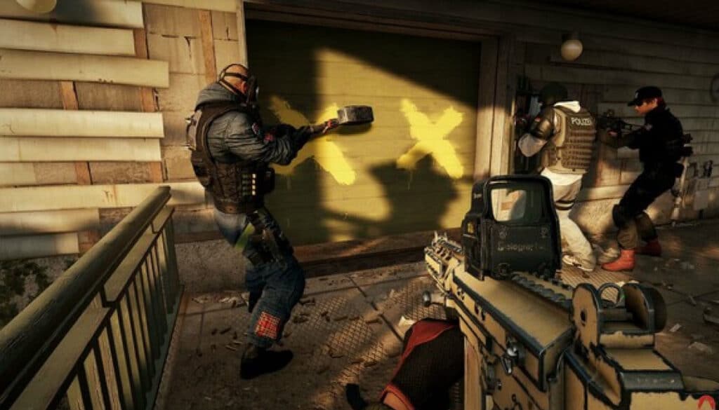 A tactical team prepares to breach a green door with yellow X marks in Siege X. The scene is tense, featuring armed individuals in gear, with focus on teamwork